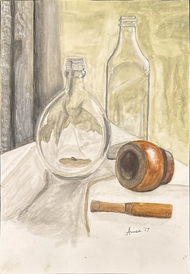 Two clear glass bottles, a tipped wooden vessel and a small wooden tool rest on a pale cloth.