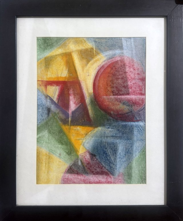 A framed abstract composition brings together a red circle, yellow planes and deep blue geometric forms.