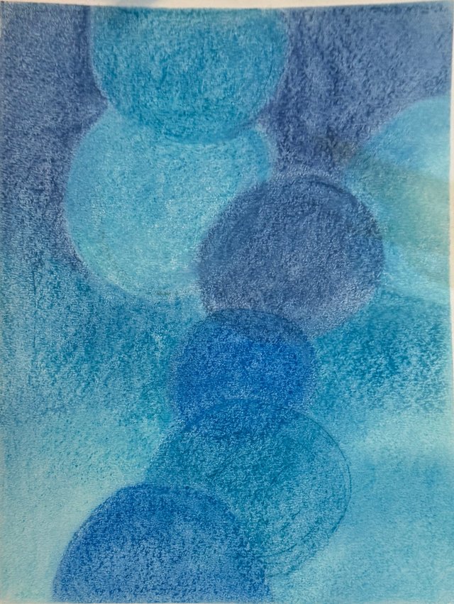 Overlapping blue circles form a loose vertical rhythm across a textured blue field.